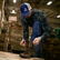 Worker in a sawmill wearing Durango Maverick XP lacer work boots
