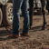 Woman tacking up horse wearing Durango Shyloh western boots