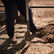 Rancher digging a hole wearing Durango Workin' Rebel Texas flag steel toe boots