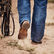 Cowboy walking in arena with DDB0410 western rodeo performance boot