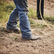 Cowboy walking in arena with DDB0413 western rodeo performance boot