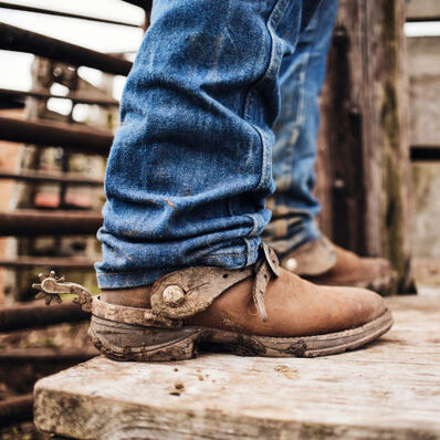 Rancher wearing Durango Rebel western boots.