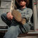 Man picking hoof on horse wearing Durango Shyloh western boots