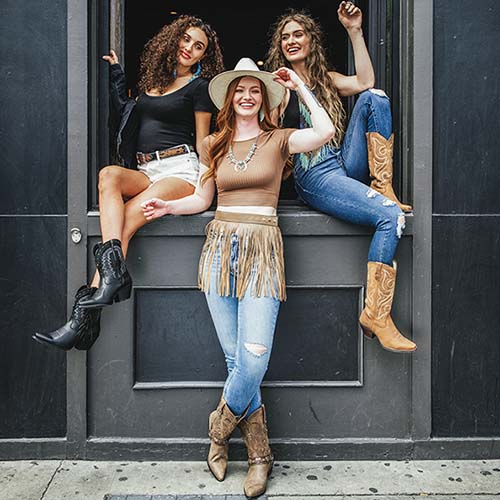 Women wearing festival fashion boots